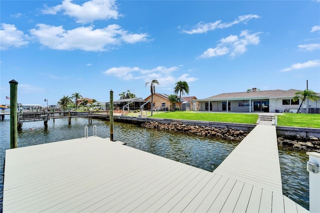 6334 Cocoa Ln, Apollo Beach, FL 33572 - dock area featuring a water view and a lawn