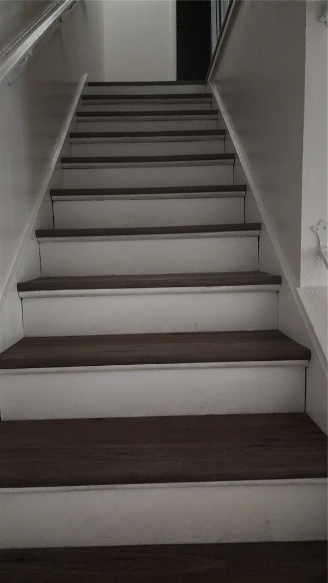 7107 Hernando Ct, Tampa, FL 33615 - staircase with wood finished floors