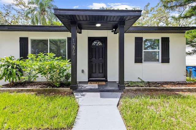 1275 Palm St, Clearwater, FL 33755 - entrance to property with stucco siding