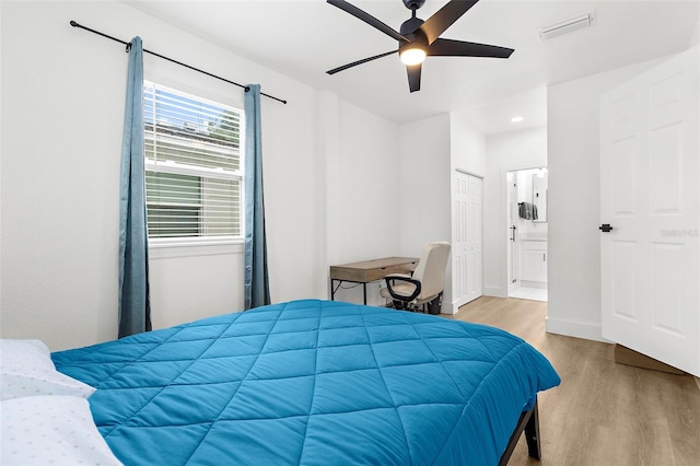 1275 Palm St, Clearwater, FL 33755 - bedroom with wood finished floors, ensuite bath, recessed lighting, and ceiling fan