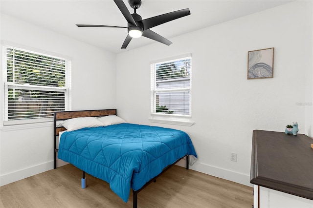 1275 Palm St, Clearwater, FL 33755 - bedroom featuring light wood finished floors and ceiling fan