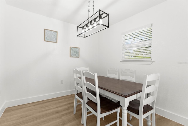1275 Palm St, Clearwater, FL 33755 - dining space with baseboards and light wood-style floors
