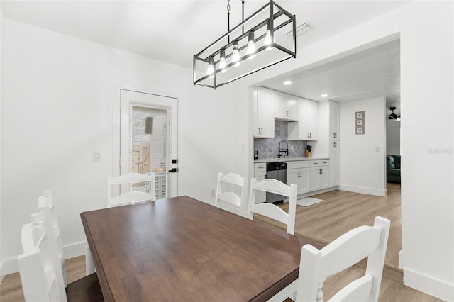 1275 Palm St, Clearwater, FL 33755 - dining space featuring light wood-type flooring, a chandelier, and recessed lighting