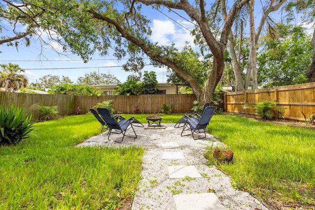1275 Palm St, Clearwater, FL 33755 - fenced backyard with an outdoor fire pit