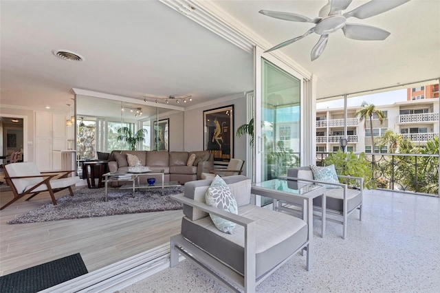 1060 N Shore Dr NE Unit 6, Saint Petersburg, FL 33701 - living area with floor to ceiling windows, a ceiling fan, and ornamental molding