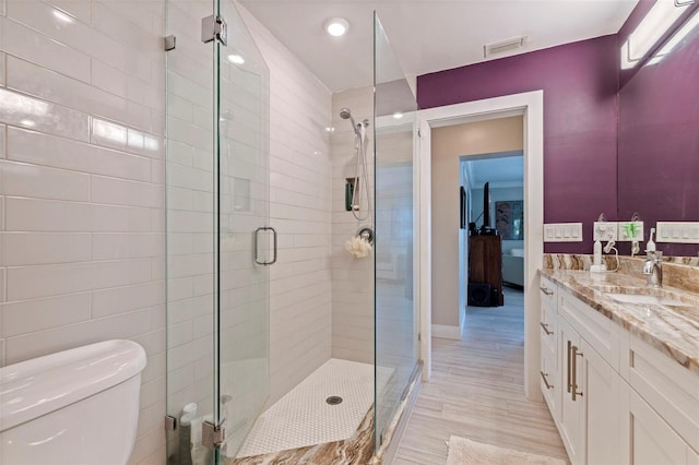 1060 N Shore Dr NE Unit 6, Saint Petersburg, FL 33701 - full bath with vanity, a shower stall, and wood finished floors