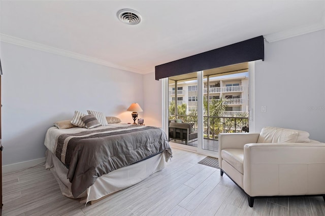 1060 N Shore Dr NE Unit 6, Saint Petersburg, FL 33701 - bedroom with ornamental molding, access to exterior, and wood finished floors