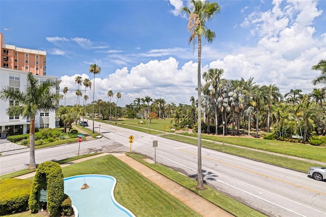 1060 N Shore Dr NE Unit 6, Saint Petersburg, FL 33701 - view of asphalt road featuring sidewalks, traffic signs, and curbs