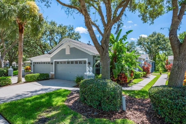 6044 Sandhill Ridge Dr, Lithia, FL 33547 - ranch-style home with a garage and concrete driveway