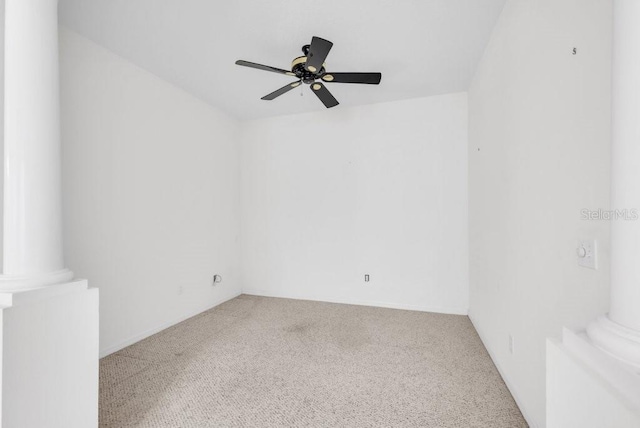 6044 Sandhill Ridge Dr, Lithia, FL 33547 - carpeted empty room featuring a ceiling fan and decorative columns