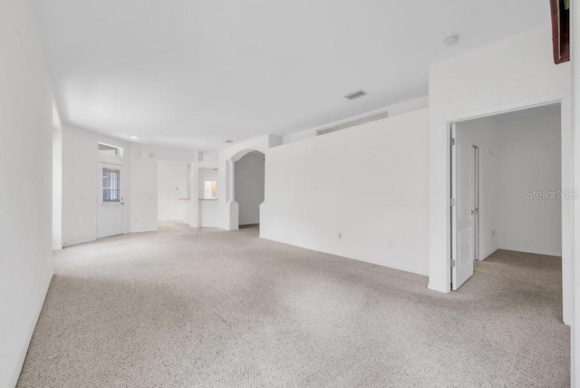 6044 Sandhill Ridge Dr, Lithia, FL 33547 - empty room with light carpet and arched walkways