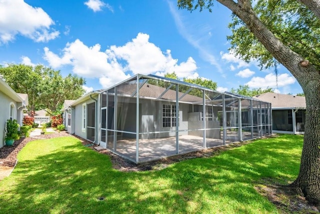 6044 Sandhill Ridge Dr, Lithia, FL 33547 - rear view of house with a lawn, a patio area, and glass enclosure