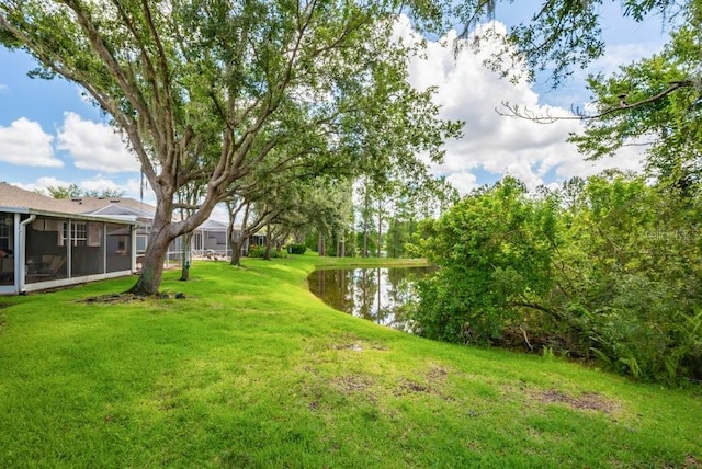 6044 Sandhill Ridge Dr, Lithia, FL 33547 - view of grassy yard with a water view and a sunroom