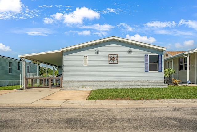 8443 Fantasia Park Way, Riverview, FL 33578 - view of side of home with an attached carport and driveway