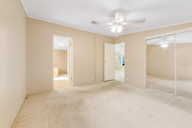 8443 Fantasia Park Way, Riverview, FL 33578 - unfurnished bedroom featuring carpet flooring, a closet, ceiling fan, ornamental molding, and ensuite bath