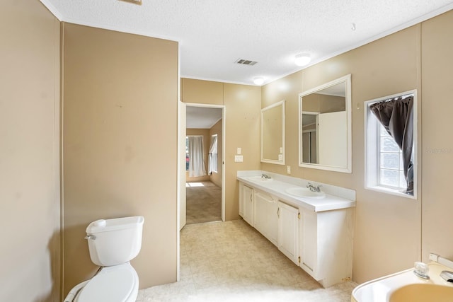 8443 Fantasia Park Way, Riverview, FL 33578 - full bath featuring a textured ceiling, double vanity, and tile patterned floors