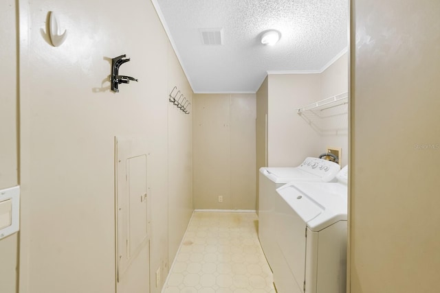 8443 Fantasia Park Way, Riverview, FL 33578 - laundry area featuring separate washer and dryer, a textured ceiling, light floors, and crown molding