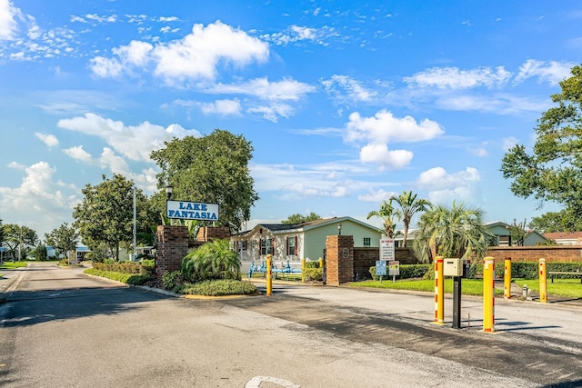 8443 Fantasia Park Way, Riverview, FL 33578 - view of asphalt road with curbs, a gated entry, and a residential view
