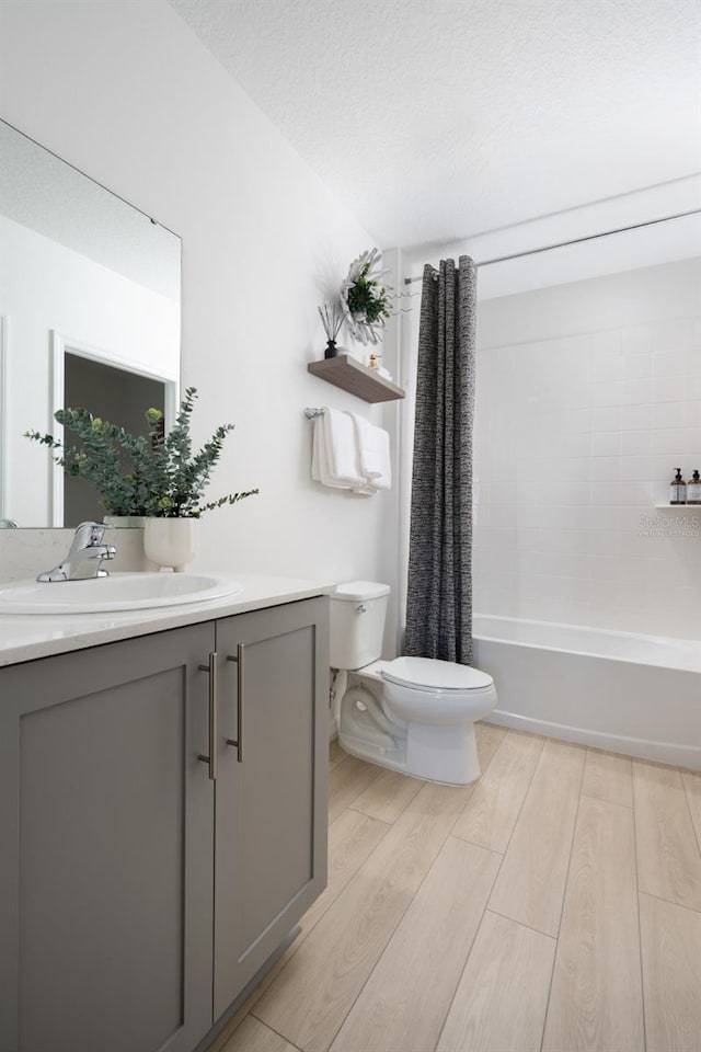 12822 Canter Call Rd, Lithia, FL 33547 - bathroom featuring vanity, wood finished floors, and shower / tub combo