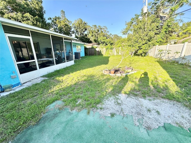 1605 Logan St, Clearwater, FL 33755 - fenced backyard featuring a sunroom