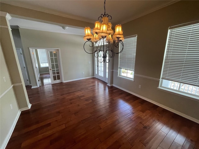 405 Islebay Dr, Apollo Beach, FL 33572 - unfurnished dining area featuring a chandelier, dark wood finished floors, and ornamental molding