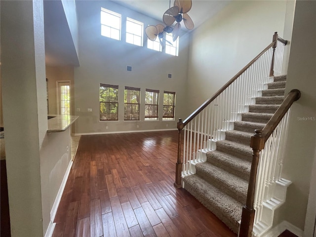 405 Islebay Dr, Apollo Beach, FL 33572 - foyer featuring hardwood / wood-style floors, plenty of natural light, stairway, and a high ceiling