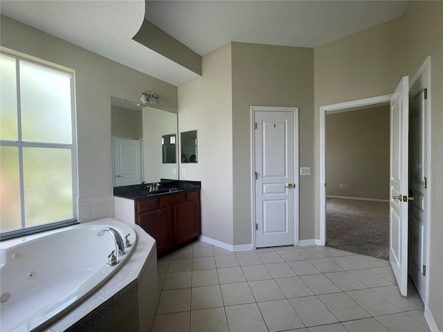 405 Islebay Dr, Apollo Beach, FL 33572 - bathroom with a whirlpool tub, vanity, and tile patterned flooring