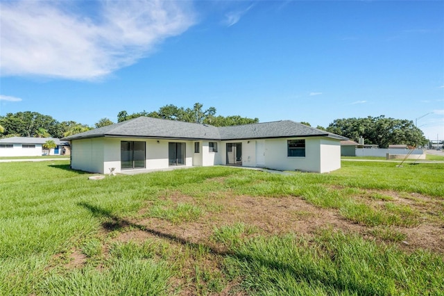 2151 Groveglen Ln S, Lakeland, FL 33813 - back of house featuring a yard and stucco siding