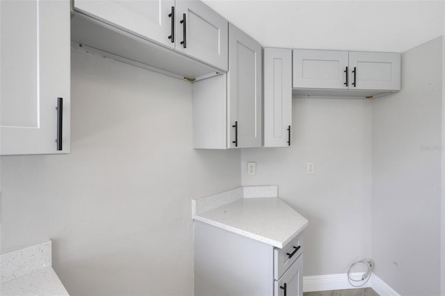 2151 Groveglen Ln S, Lakeland, FL 33813 - laundry room featuring baseboards