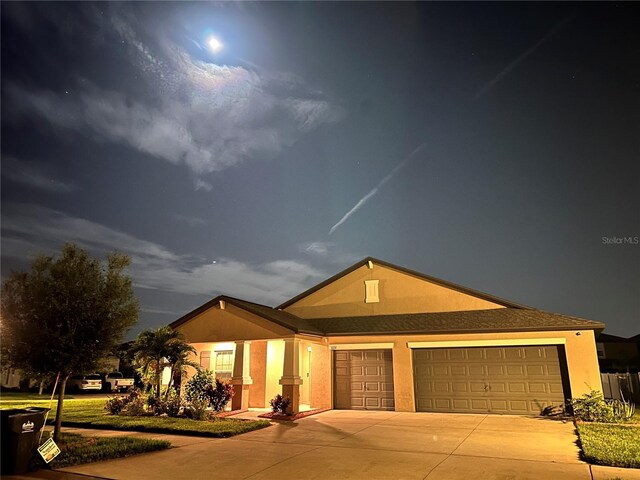10211 Cakebread Ln, Riverview, FL 33578 - single story home with stucco siding, concrete driveway, and an attached garage