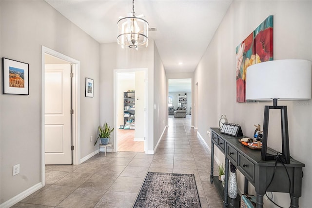 10211 Cakebread Ln, Riverview, FL 33578 - hallway with a chandelier and light tile patterned flooring