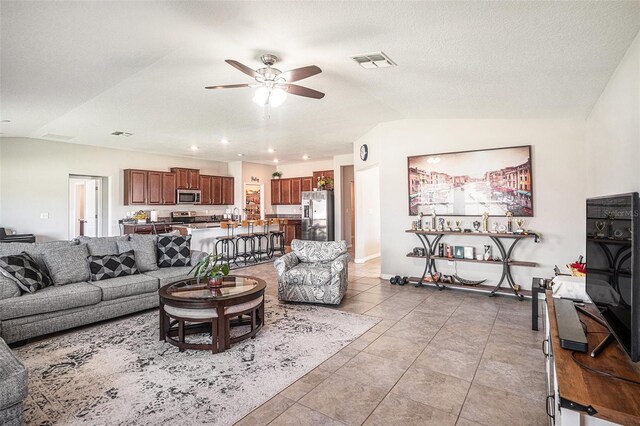 10211 Cakebread Ln, Riverview, FL 33578 - living area featuring a ceiling fan, vaulted ceiling, light tile patterned floors, and recessed lighting