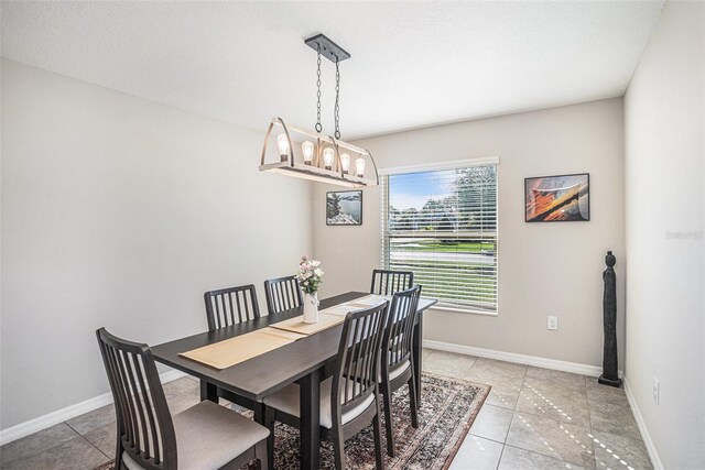 10211 Cakebread Ln, Riverview, FL 33578 - dining space featuring light tile patterned floors and a chandelier