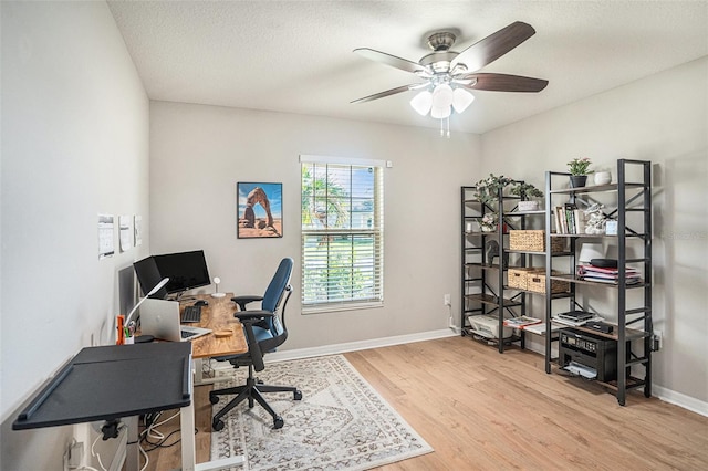 10211 Cakebread Ln, Riverview, FL 33578 - home office featuring wood finished floors, ceiling fan, and a textured ceiling