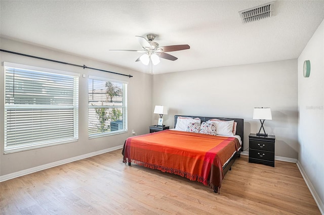 10211 Cakebread Ln, Riverview, FL 33578 - bedroom featuring wood finished floors and a ceiling fan