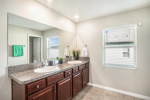 10211 Cakebread Ln, Riverview, FL 33578 - full bathroom with double vanity and baseboards