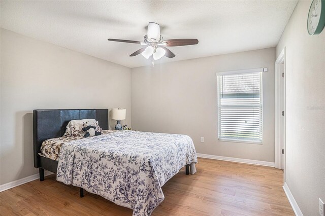 10211 Cakebread Ln, Riverview, FL 33578 - bedroom featuring light wood-style flooring and a ceiling fan