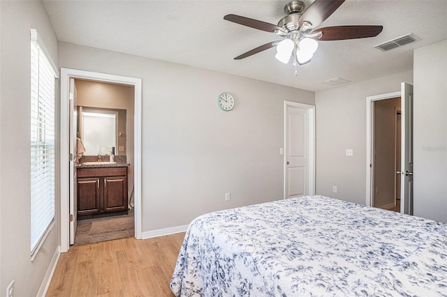 10211 Cakebread Ln, Riverview, FL 33578 - bedroom featuring light wood finished floors, a ceiling fan, and ensuite bathroom