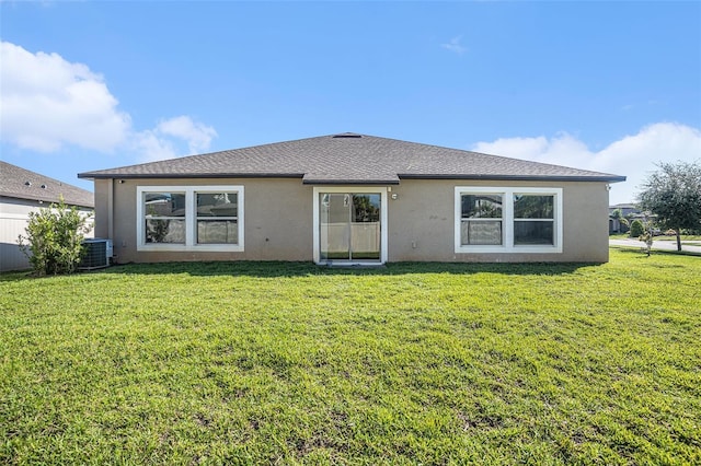 10211 Cakebread Ln, Riverview, FL 33578 - rear view of house featuring stucco siding and a yard