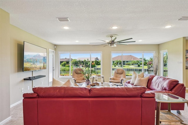 2110 W View Dr, Sun City Center, FL 33573 - living room featuring a textured ceiling, ceiling fan, and recessed lighting