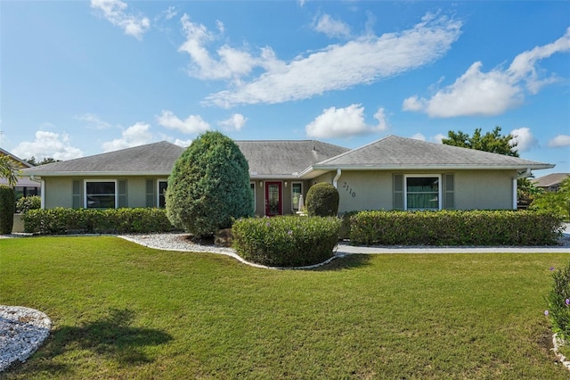 2110 W View Dr, Sun City Center, FL 33573 - single story home featuring stucco siding and a front lawn