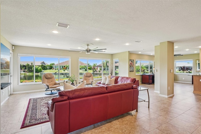 2110 W View Dr, Sun City Center, FL 33573 - living area with plenty of natural light, a textured ceiling, light tile patterned floors, recessed lighting, and ceiling fan