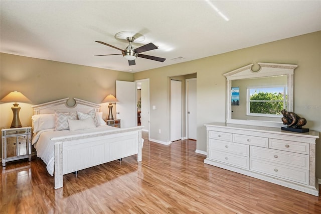 2110 W View Dr, Sun City Center, FL 33573 - bedroom featuring light wood-style flooring and a ceiling fan