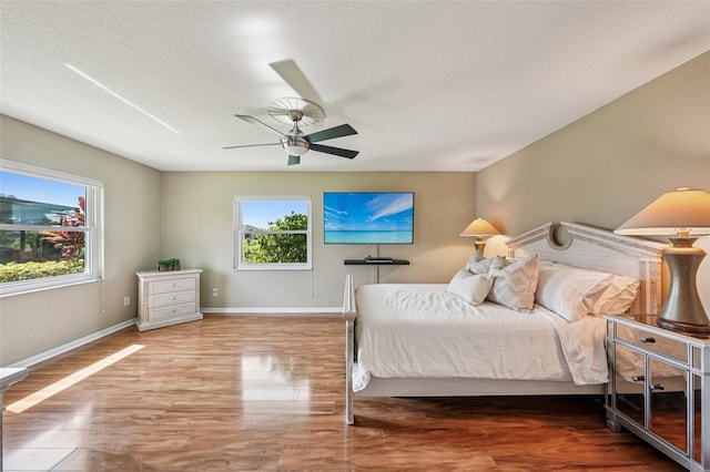 2110 W View Dr, Sun City Center, FL 33573 - bedroom featuring ceiling fan and wood finished floors