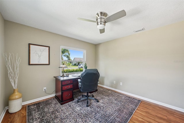 2110 W View Dr, Sun City Center, FL 33573 - office area with wood finished floors, ceiling fan, and a textured ceiling