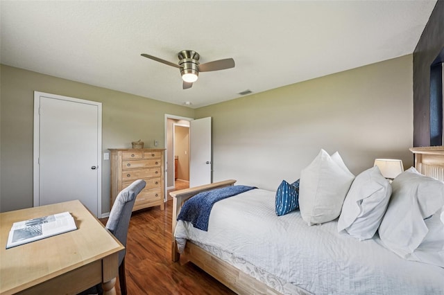 2110 W View Dr, Sun City Center, FL 33573 - bedroom with dark wood finished floors, ceiling fan, and a desk