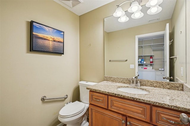 2110 W View Dr, Sun City Center, FL 33573 - half bath featuring vanity, washer and dryer, and a chandelier
