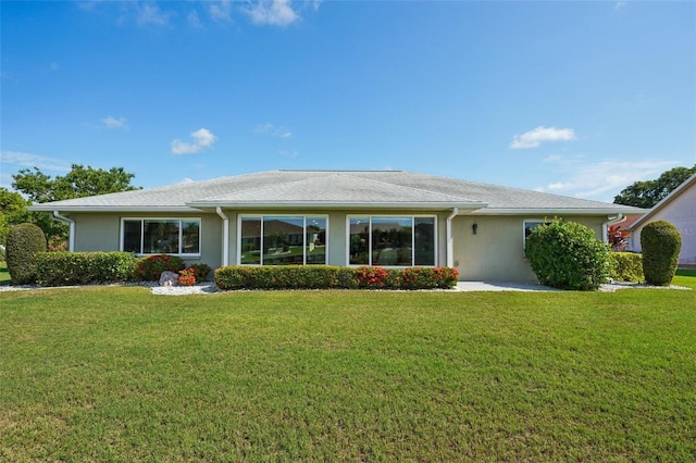2110 W View Dr, Sun City Center, FL 33573 - back of house with a lawn and stucco siding