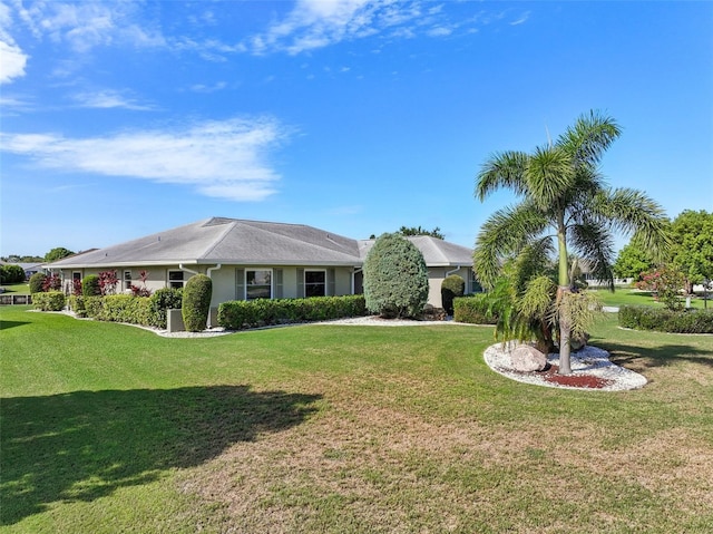 2110 W View Dr, Sun City Center, FL 33573 - view of front of property featuring a front lawn and stucco siding