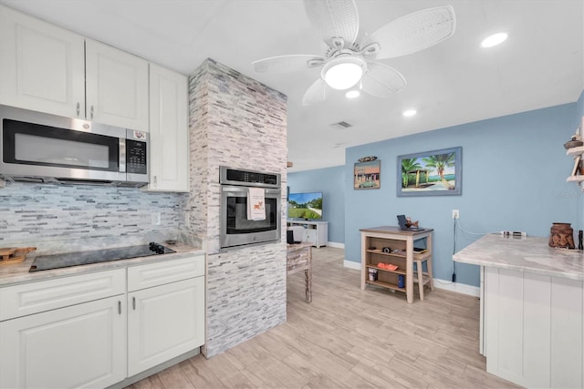 4718 24th Ave S, Saint Petersburg, FL 33711 - kitchen featuring stainless steel appliances, tasteful backsplash, white cabinets, a ceiling fan, and recessed lighting